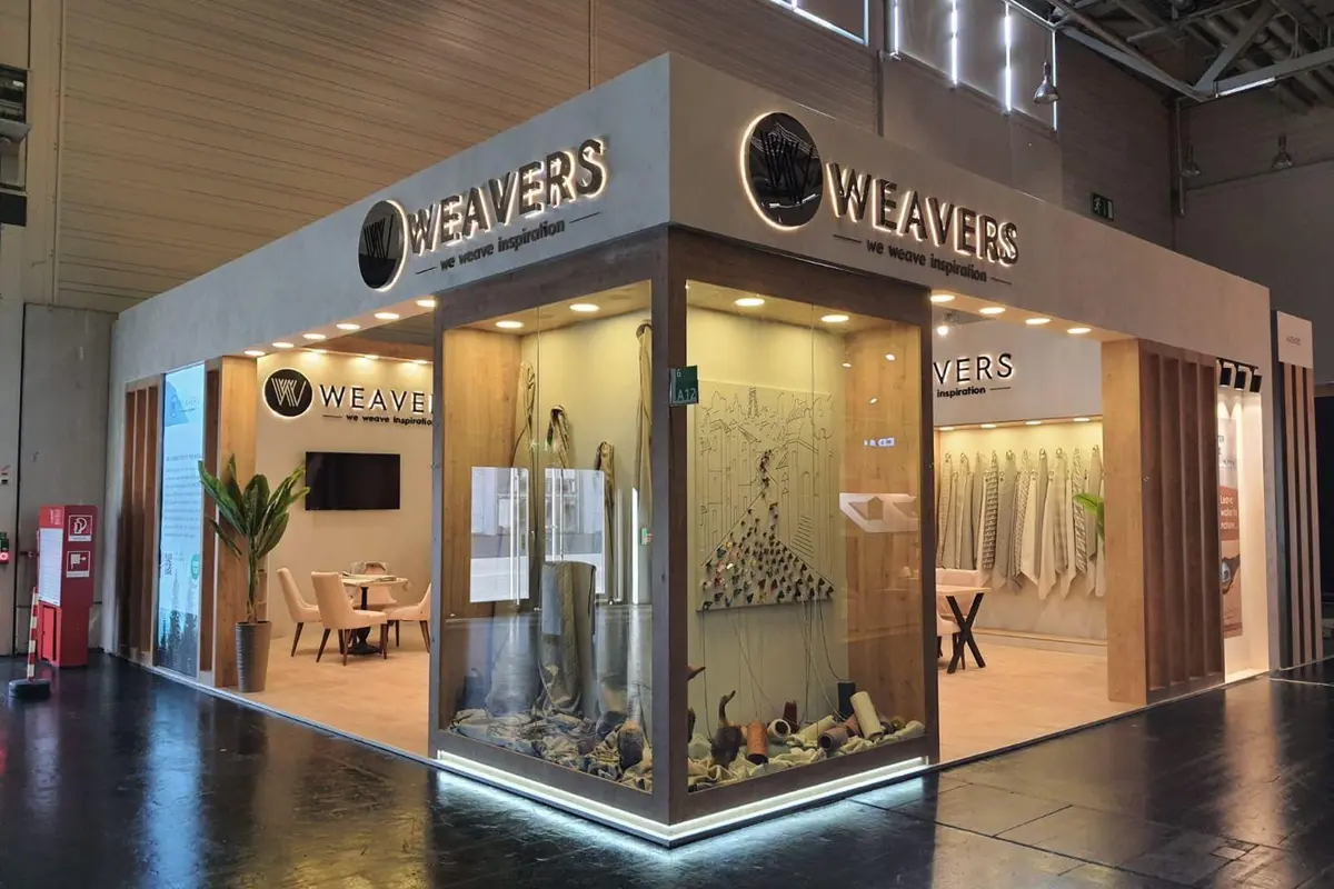 Weavers: Textile exhibition stand with sample displays and meeting space.